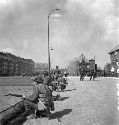 Infantry of the Essex Scottish Regiment guarding one of the main streets of Groningen, Netherlands, 14 April 1945