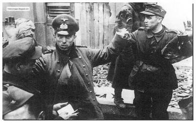 A-russian-soldier-checks-document-of-captured-germansoldiers-berlin-1945.jpg